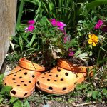 old shoes made into a flower planter