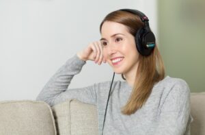 Smiling oman with headphones on